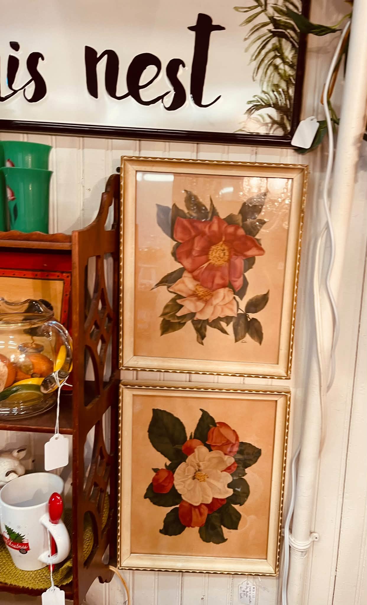 Vintage prints on a shop wall at The Rusty Chandelier